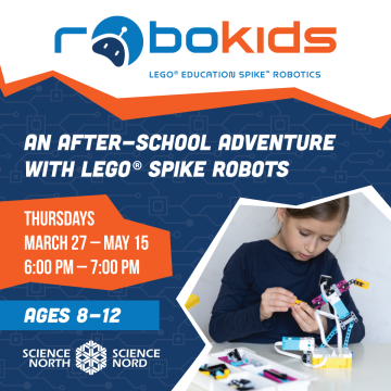 robokids; picture of young girl playing with lego spike robot